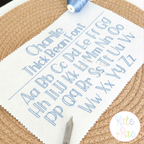Charlie Thick Bean Stitch Embroidery Font: Full upper and lowercase alphabet stitched in light blue thick bean stitch on white fabric