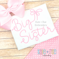 Preppy Big Sister Embroidery Design: The words Big Sister in pink script with a bow on a white shirt