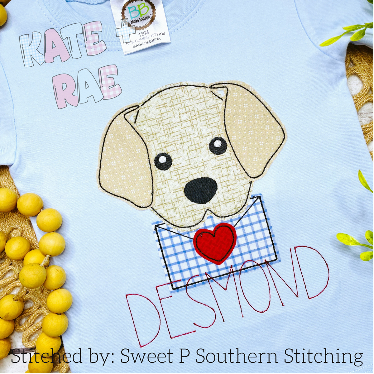 Boy Valentine's Day Puppy Bean Stitch Applique Embroidery Design: Puppy holding a blue gingham envelope with a red heart above the name Desmond on a light blue shirt
