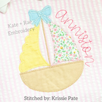 Girl's Scalloped Sailboat Zigzag Applique Embroidery Design: Scalloped sailboat with a blue bow and yellow and floral sails beside the name Anniston on pink seersucker