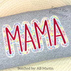 MAMA Double Satin Stitch Applique Embroidery Design: The word MAMA in red letters with a rainbow speckled double outline on a gray sweatshirt