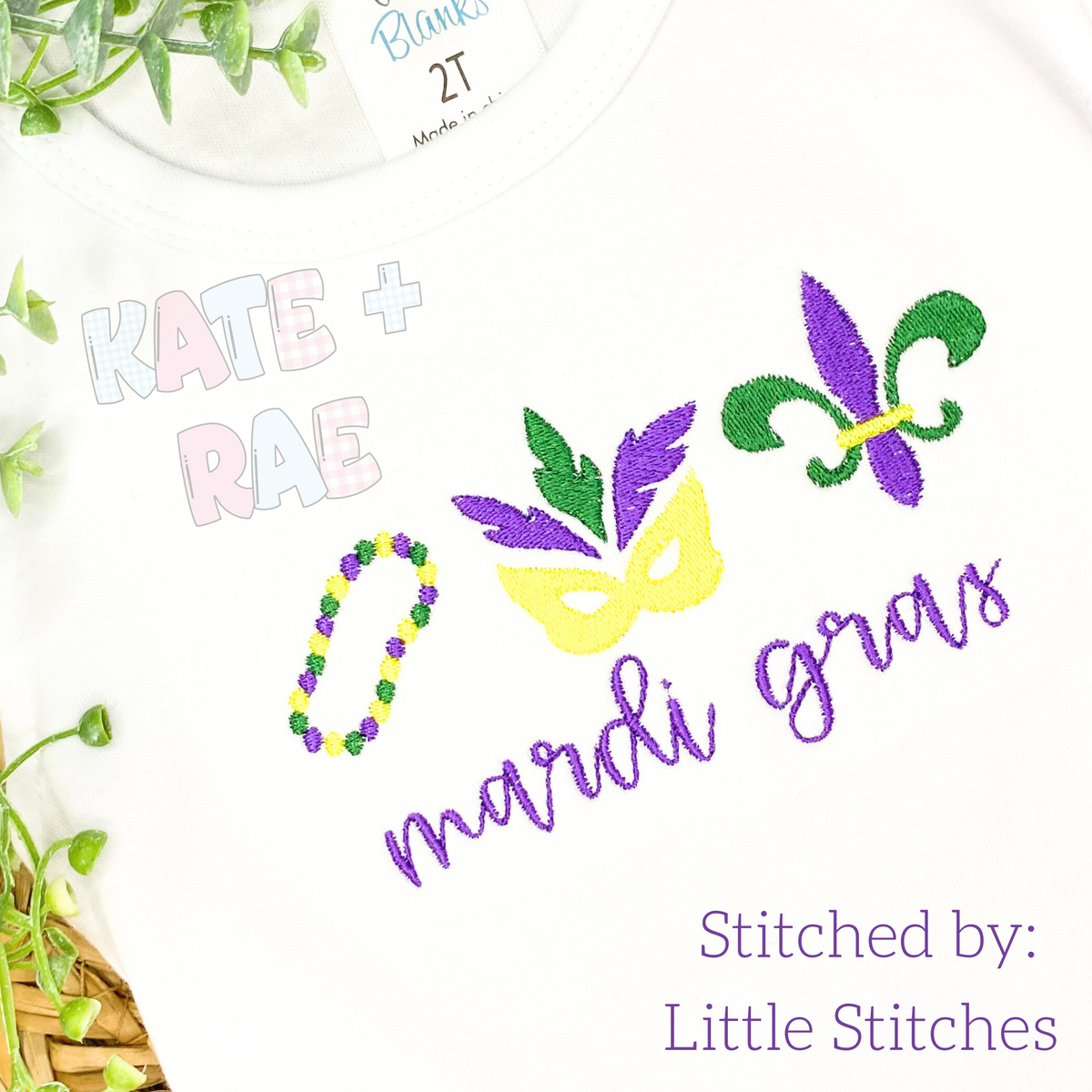Girls Mardi Gras Fill Stitch Trio Embroidery Design: Mardi Gras beads, feathered mask, and fleur de lis above the words mardi gras in purple script on a white shirt