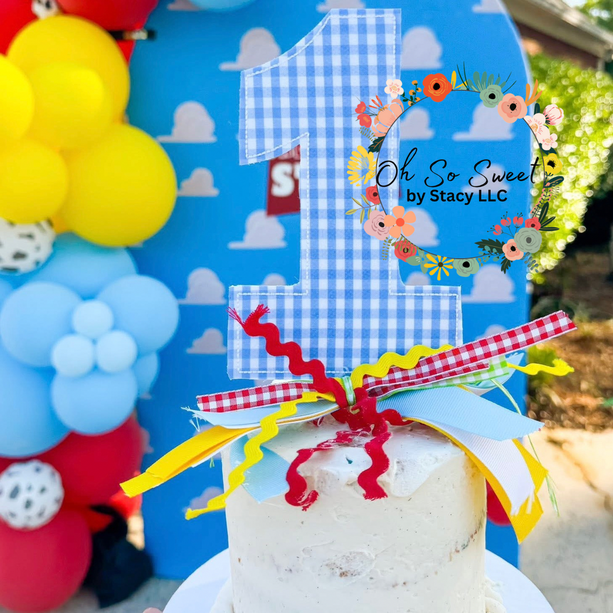 Birthday Numbers Bean Stitch Applique Embroidery Design: Blue gingham number 1 applique cake topper with red and yellow ribbons on a smash cake