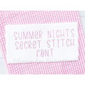 Summer Nights Secret Stitch Embroidery Font: The words Summer Nights Secret Stitch Font stitched in pink on white fabric over pink gingham
