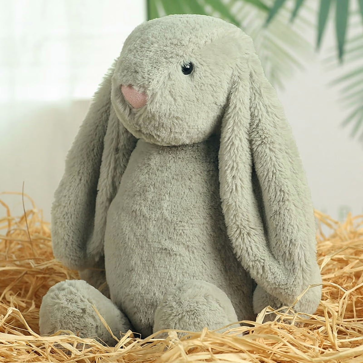 Embroidered Easter Bunnies: Sage green plush bunny with long floppy ears sitting in straw