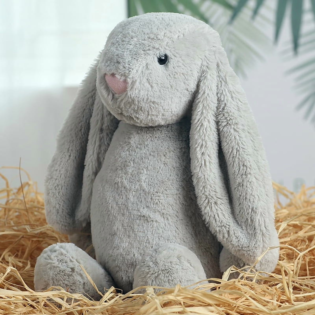Embroidered Easter Bunnies: Gray plush bunny with long floppy ears sitting in straw