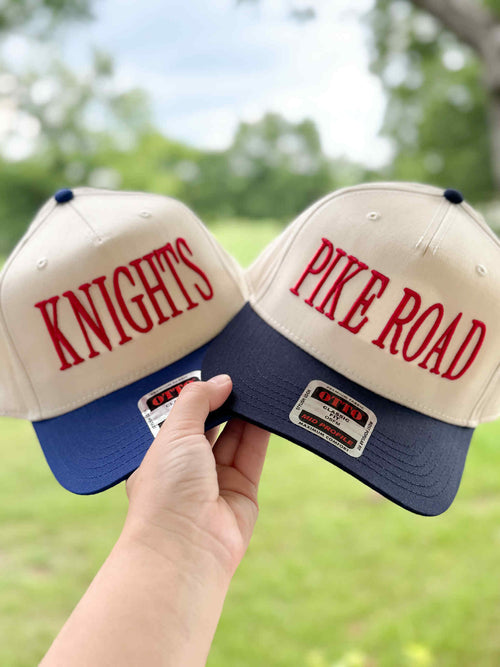 Adult Otto Trucker Hats with Puff Embroidery: Two cream and navy trucker hats with KNIGHTS and PIKE ROAD in red puff embroidery