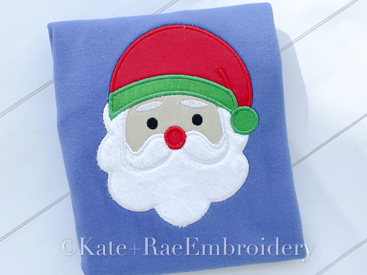 Santa Satin Stitch Applique Embroidery Design: Satin stitch applique Santa face with a red hat and white beard on a blue shirt